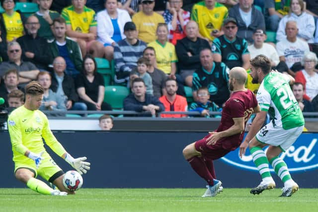 McGregor, right, helps put off Teemu Pukki as Kevin Dabrowski makes a save towards the end of Hibs' 1-0 win against Norwich City on Sunday