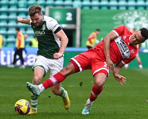 Hibs defender Chris Cadden attempts to shake off the attentions of Middlesbrough's Rodrigo Muniz during the mid-season friendly clash at Easter Road