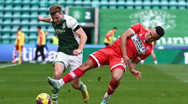 Hibs defender Chris Cadden attempts to shake off the attentions of Middlesbrough's Rodrigo Muniz during the mid-season friendly clash at Easter Road