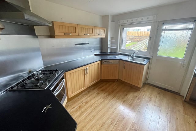 There is a spacious kitchen leading out to the rear garden.