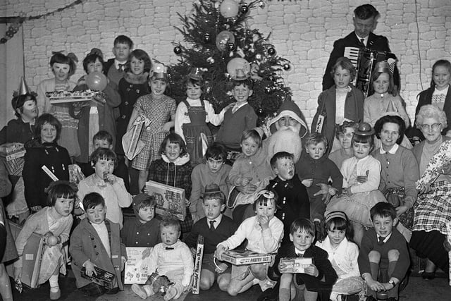 Santa Claus at a children's party by the Craigmillar Hearts Supporter's Club in Niddrie Mains Terrace Edinburgh, December 1964.