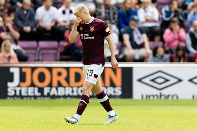 Alex Cochrane walks off after being shown his marching orders in the final match of the season between Hearts and Hibs. Picture: SNS