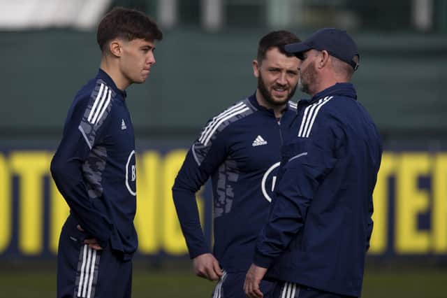 Scotland boss Steve Clarke speaks to former hearts full-back Aaron Hickey and current Jambo defender Craig Halkett, both called into the squad for the first time