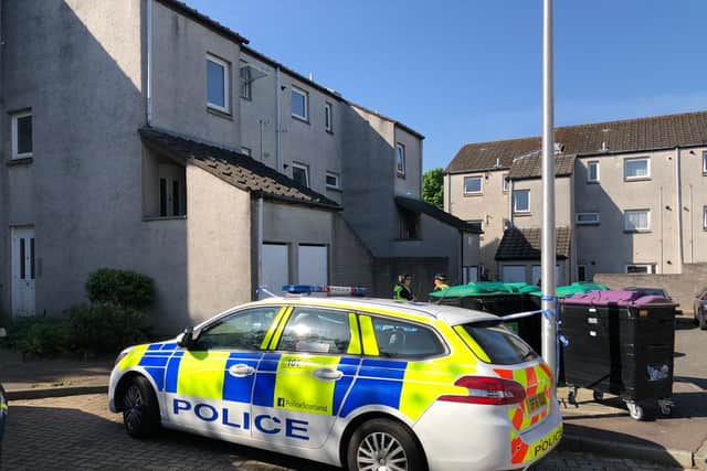 A police vehicle outside an address in North Bughtlin Brae where a 47-year-old man died