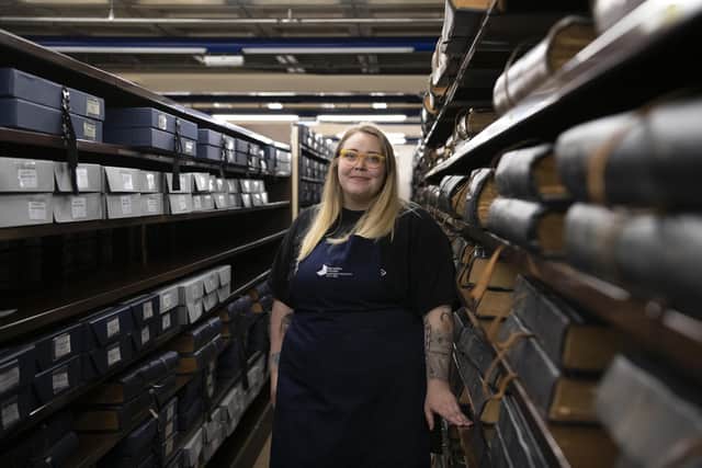 Conservator Claire Hutchison at the stacks where newspaper collections are held in optimal environmental conditions by the National Library of Scotland at its Edinburgh archive centre.