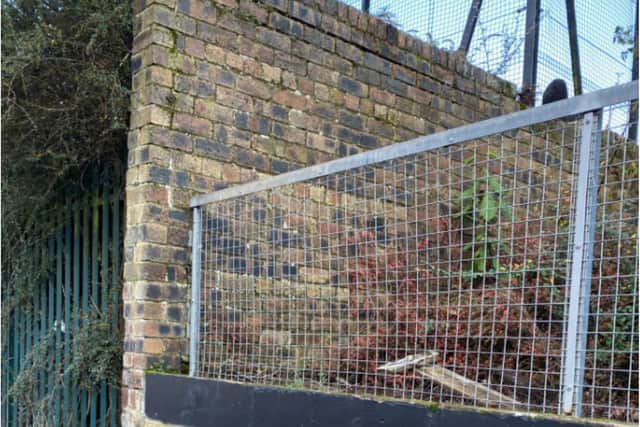 The wall that Jamie climbed to watch his son play football. Picture credit: Jamie Brodie.