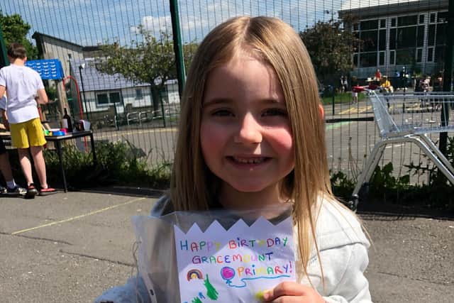 Kylie in P1 with her birthday card.