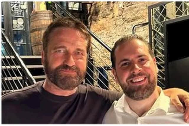 Gerard Butler, left, posed for a picture with Divino Enoteca owner Alberto Crolla, which the restaurant shared on their social media channels. Photo: Leandro Crolla