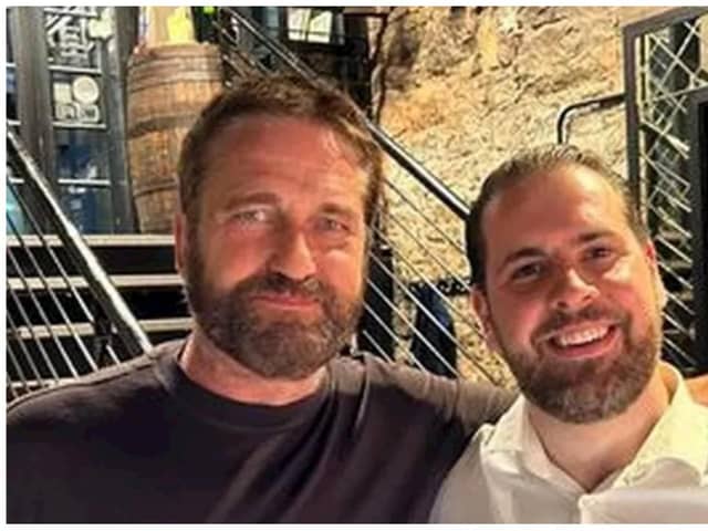 Gerard Butler, left, posed for a picture with Divino Enoteca owner Alberto Crolla, which the restaurant shared on their social media channels. Photo: Leandro Crolla