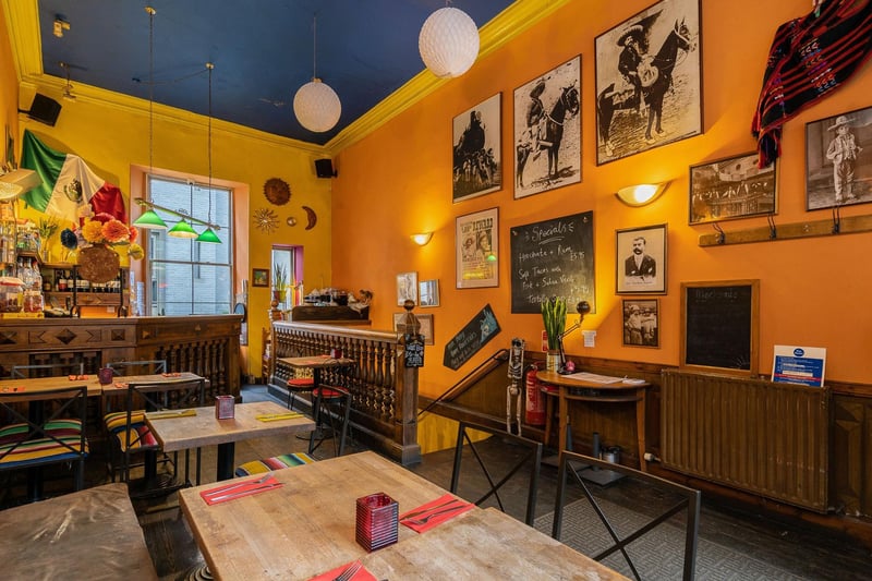The dining area on the ground floor accommodates space for 15 covers. Decorated in vibrant colours the cosy space offers views of one of Edinburgh’s most famous streets.