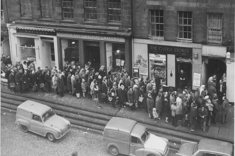 Queues in Edinburgh's Lawnmarket to collect Hogmanay refreshments, 1966.