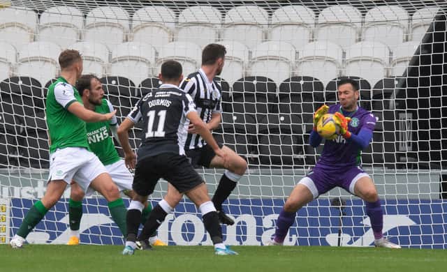 Ofir Marciano makes a save to keep the score at 2-0 to Hibs towards the end of the first half. Picture: SNS