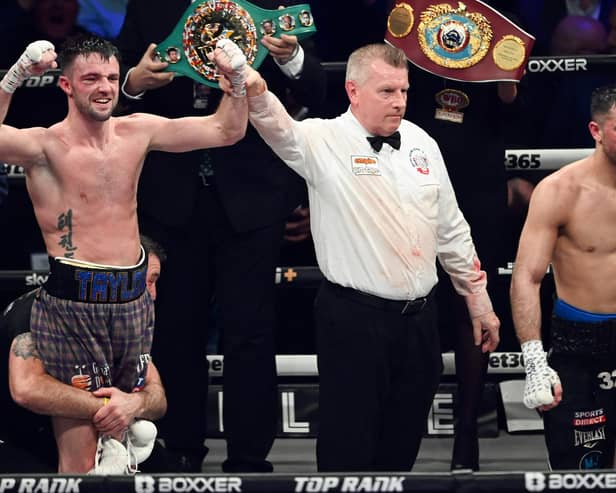Josh Taylor, left, is declared the winner in Glasgow earlier this year as opponent Jack Catterall walks off in disgust. Picture: SNS