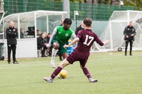 Kanayo Megwa looks to get forward for Hibs on the right side. Picture: Maurice Dougan