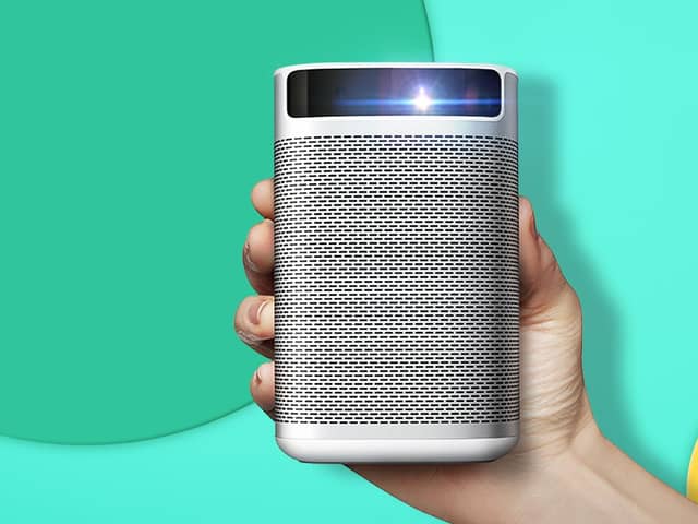 The XGIMI MoGo Pro 1080p portable projector is a compact, neat, curved-edge unit of white and silver. Image XGIMI