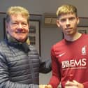 Guy McGarry receiving the sponsors' star man award from Bill Kane after his two-goal display in the win over Leith Athleti