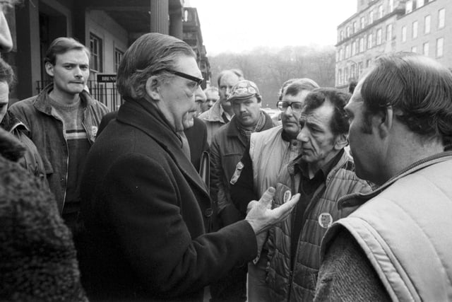 Scottish NUM leader Mick McGahey speaks to miners as he leaves a meeting to discuss prolonging the miners strike  in Scotland in March 1985.