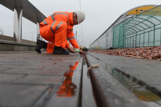 An engineer testing the tram tracks at the Edinburgh Airport tram stop in November, 2012.