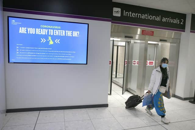 A passengers passes through International arrivals at Edinburgh airport, Scotland, ahead of new quarantine rules in Scotland which mean that from today, travellers from any country will be forced to self-isolate in a hotel for 10 days on arrival.