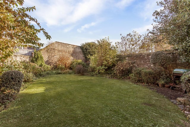 The villa is accompanied by a good-sized private rear garden, predominantly laid to lawn and bordered by a wealth of leafy trees and shrubbery and partially bordered by walls.