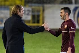 Robbie Neilson congratulates Hearts defender Michael Smith at full-time.