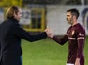 Robbie Neilson congratulates Hearts defender Michael Smith at full-time.