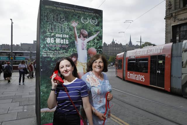Kate, Allie, and the ’86 Mets star Kate Barry on the retro 1980s phone as used in the Fringe show’s poster on St Andrew Street, Edinburgh. Picture: Graham Clark