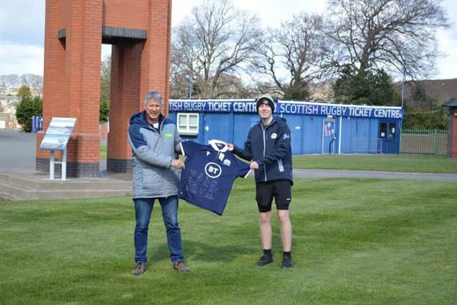 Sean Lineen presents Ben Liddall with a signed Scotland jersey.
