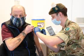 Derek Fraser from Edinburgh receiving a Covid-19 vaccine from military doctor Captain Robert Reid in February.