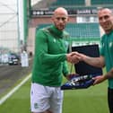 Hibs' David Gray presents Scott Brown with a gift before the midfielder's final game as a Celtic player at Easter Road. Picture: SNS