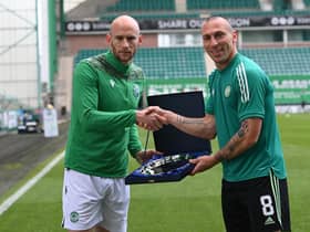 Hibs' David Gray presents Scott Brown with a gift before the midfielder's final game as a Celtic player at Easter Road. Picture: SNS