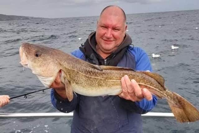 Dean Thompson proudly holding a 12lb 2oz cod, the best landed for 12 years on an Aquamarine Charters boat out of Eyemouth. Picture: Aquamarine Charters