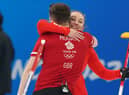 Great Britain's Edinburgh duo Jenn Dodds and Bruce Mouat celebrate winning their mixed doubles match against Canada during round robin session 2 in Beijing