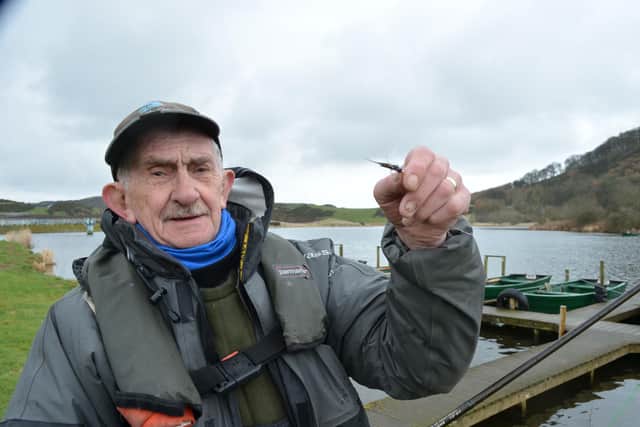William 'Phally' Cowan with his fly find, picked up in a Fife fishery car park.