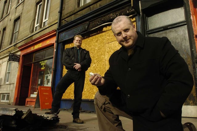 Two bouncers who saved residents from a tenement fire on March 27, 2013 in the early hours of the morning. From left: Andrew Warburton(Front) and John Lawson outside the ruined shop front at 200 Dalry Road.