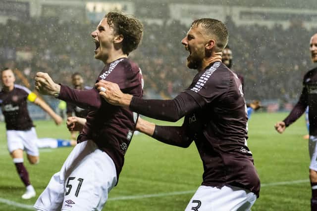 Alex Lowry celebrates scoring his first goal for Hearts in the dying seconds at Kilmarnock. Pic: SNS