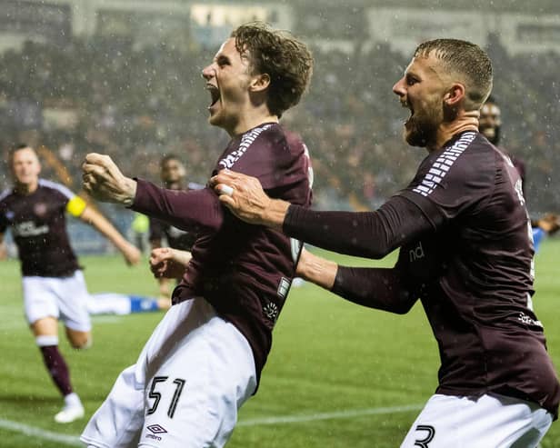 Alex Lowry celebrates scoring his first goal for Hearts in the dying seconds at Kilmarnock. Pic: SNS