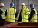 Boris Johnson speaks with staff members during a visit to Rosyth Shipyard yesterday (Picture: Jeff J Mitchell/pool/AFP via Getty Images)