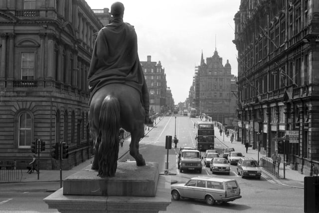 Looking up North Bridge in Edinburgh, with the Scotsman newspaper building on the right, from behind the Duke of Wellington's statue in May 1986.