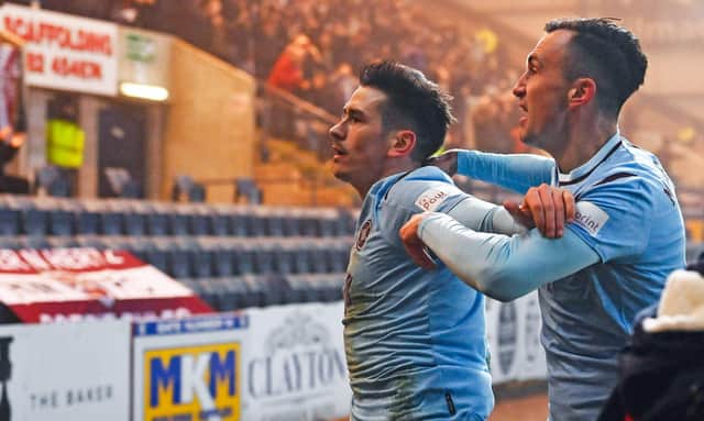 Jamie Walker celebrates in front of the Hearts fans after his match-winning goal. He wants to stay at Hearts, but only is he gets more opportunites