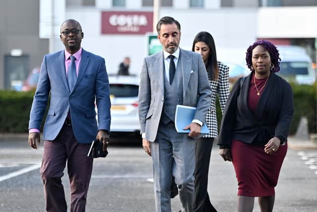 Aamer Anwar and Sheku Bayoh's family - Kadijatu Johnson and Adie Johnson - outside the Scottish Police Authority building at Pacific Quay. Picture: John Devlin