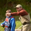 Connor Newcombe giving a young angler instruction at Kailzie