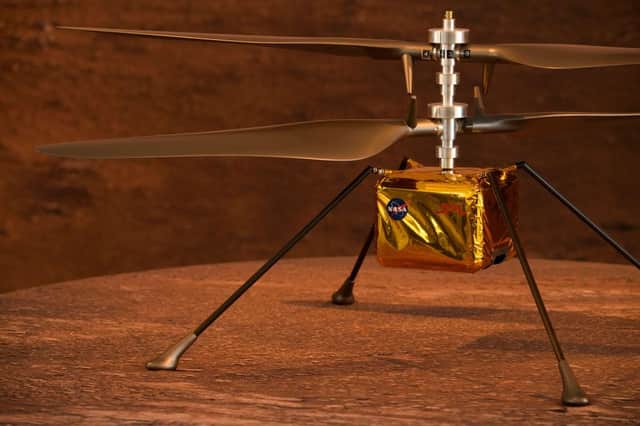 A full scale model of the experimental Ingenuity Mars Helicopter.