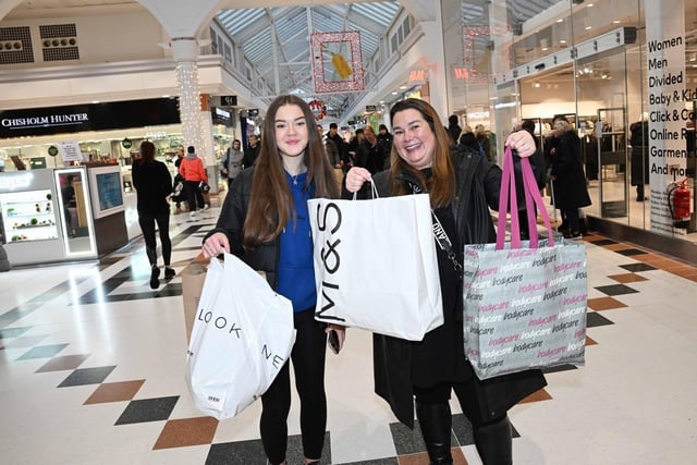 These shoppers were happy with what they picked up in Lvingston on Boxing Day.