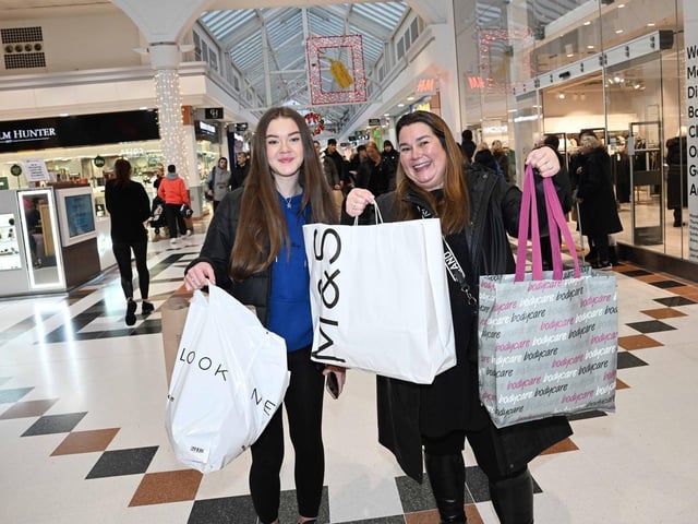 These shoppers were happy with what they picked up in Lvingston on Boxing Day.