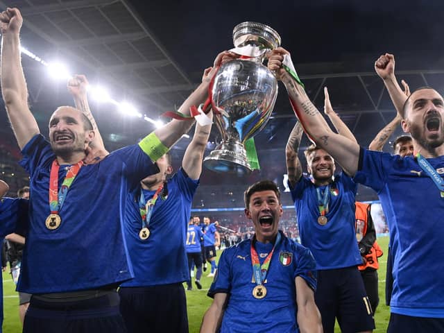 Italy's Giorgio Chiellini and Leonardo Bonucci celebrate with the trophy after winning the UEFA Euro 2020 Final at Wembley Stadium.