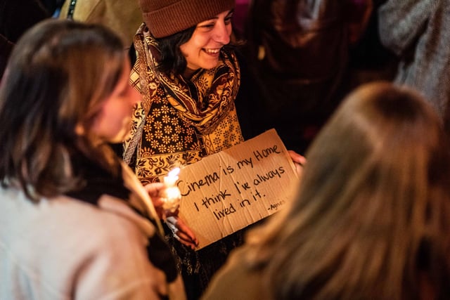 At Wednesday evening vigil outside The Filmhouse, one woman was seen holding a sign professing her love for cinema. Copyright James Armandary Photography