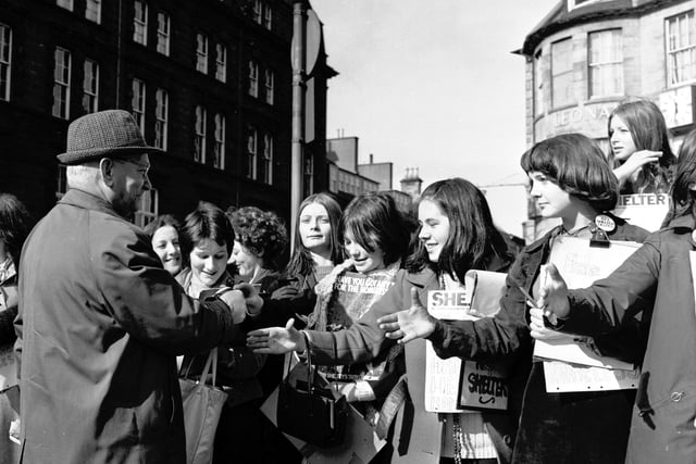 Twenty-eight girls take part in a sponsored handshake for Shelter in Princes Street Edinburgh in March 1970.