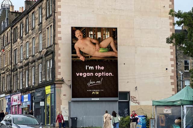 A near-naked image of Alan Cumming has appeared at the side of Leith Walk after he joined forces with animal rights campaign group PETA.