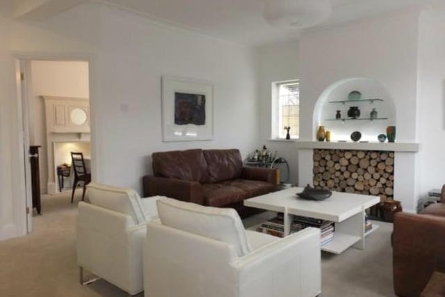 The living room before of Katy Wilson splashed £250,000 on the property.